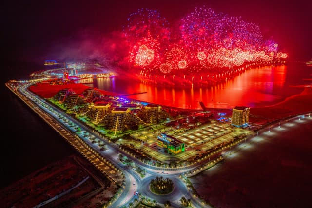 A stunning aerial capture of fireworks illuminating the night sky over Ras al Khaimah, UAE.