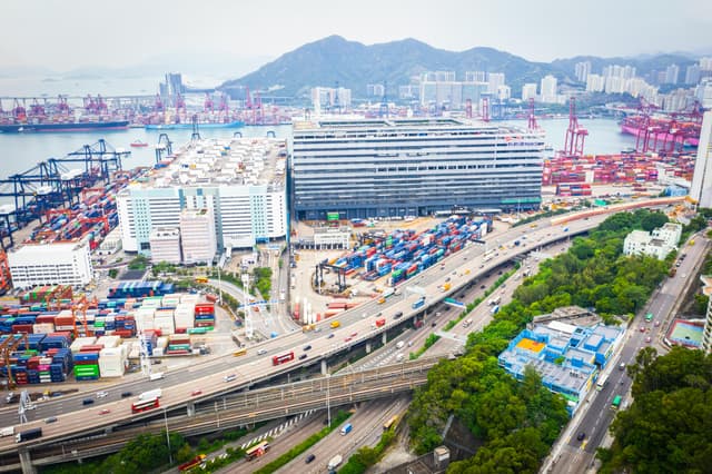 Aerial photo capturing Kwai Tsing Container Terminals, showing vibrant shipping activity in Hong Kong.