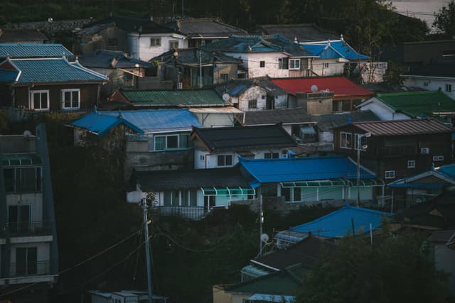 Aerial view of colorful houses in Gangneung, South Korea, showcasing a vibrant residential district.