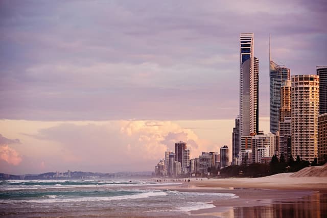 Skyline of Surfers Paradise at sunrise with skyscrapers overlooking the beach in Gold Coast, Australia.