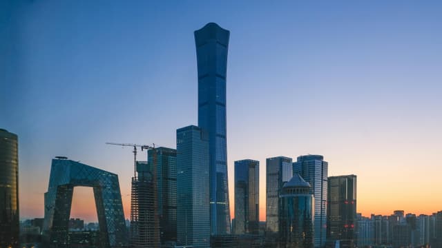 Stunning view of Beijing's skyline with iconic skyscrapers at sunset.