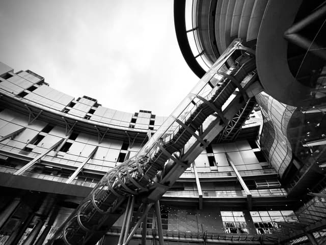 Black and white view of a modern shopping mall in Hsinchu City, Taiwan.