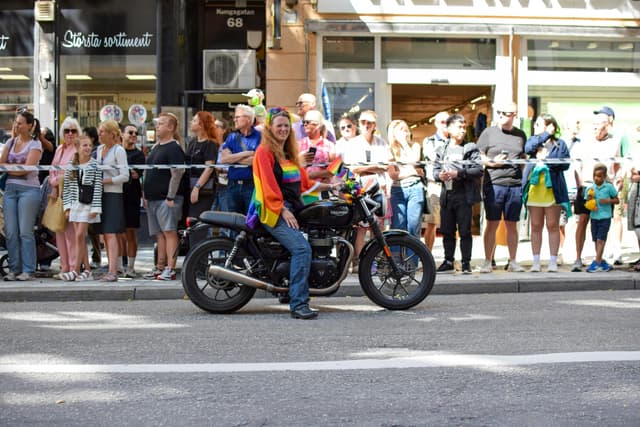Woman on a Motorcycle at a Pride Event
